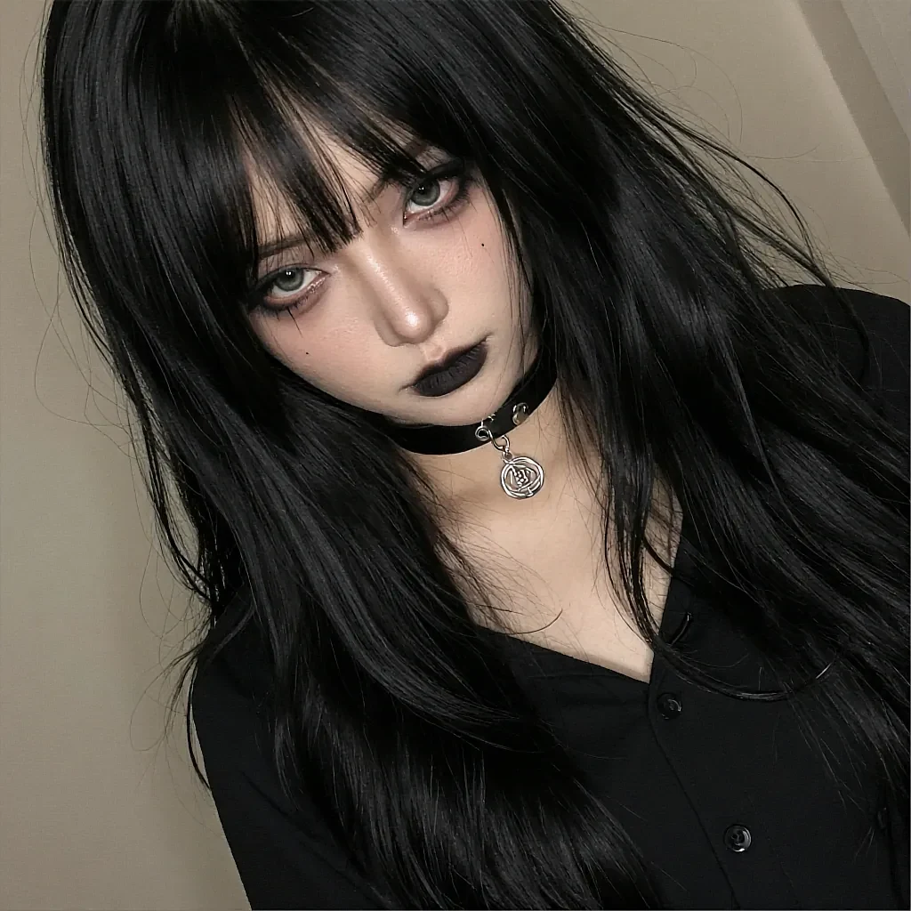 Long black-haired woman with green eyes, black lipstick, and a silver pendant leather choker